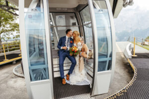 Col Pradat Elopement Dolomites couple in gondola kissing with champagne