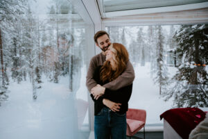 Akaslompolo Finland Winter Engagement happy couple in love in glass cabin