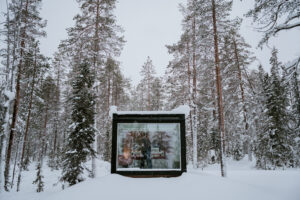 Akaslompolo Finland Winter Engagement with glass cabin and snowy trees