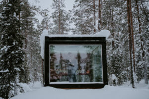 Akaslompolo Finland Winter engagement at glass cabin with candles and snow