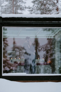 Akaslompolo Finland Winter Engagement couple embracing in cabin