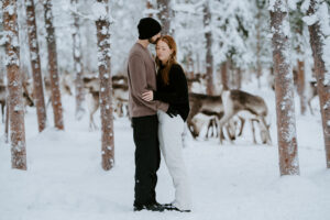 Akaslompolo Finland Winter Engagement couple embracing