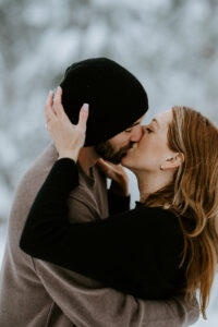 Akaslompolo Finland Winter Engagement couple kissing passionately