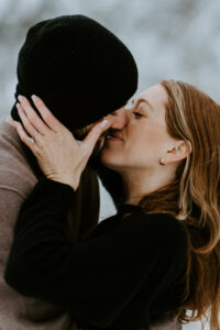 Akaslompolo Finland Winter Engagement couple embracing and kissing