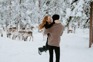 Akaslompolo Finland Winter Engagement man throws new fiancé around in the snow