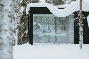 Akaslompolo Finland Winter engagement at glass cabin with snow and trees
