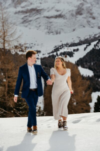 Passo Gardena Dolomites Winter Engagement, prancing through the snow