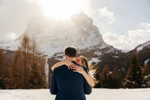 Passo Gardena Dolomites Winter Engagement, with Sassolungo in the background and it's snowing a bit