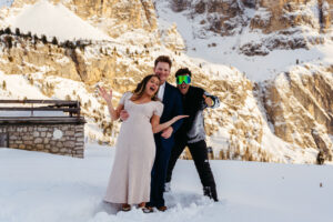 Passo Gardena Dolomites Winter Engagement, random snowboarder photo bombs couple