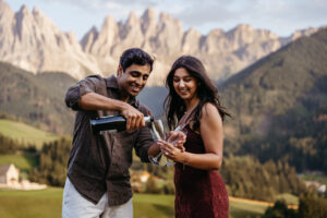 Drinking champagne to celebrate engagement at Val di Funes