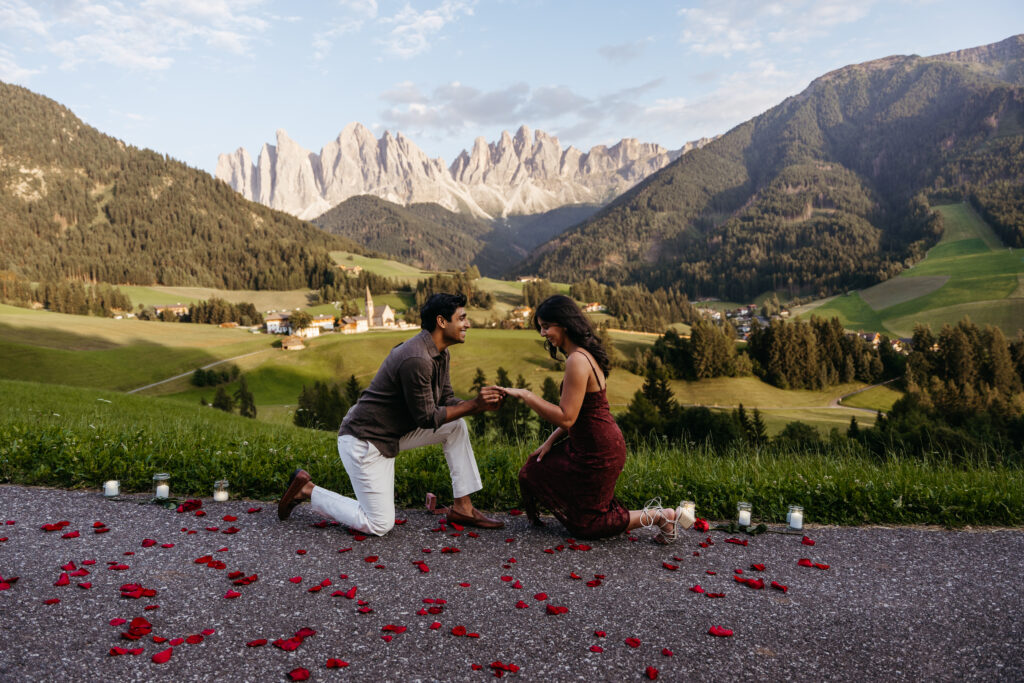 Couple celebrating the moment as she says yes to his proposal in the Dolomites