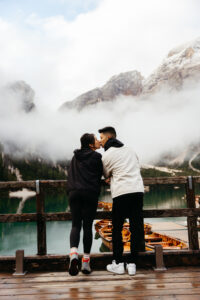 Couple kissing on boathouse platform at Lago di Braies