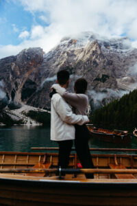 Mountain in focus and couple out of focus at Lago di Braies after engagement