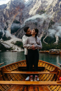 Happy couple on boat just after they got engaged at Lago di Braies