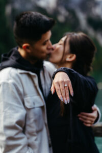 Engagement ring on girlfriend's hand during Lago di Braies proposal