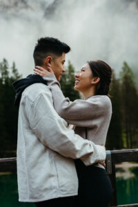 Asian couple happily engaged at Lago di Braies