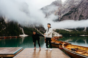 Couple laughing on dock of La Palifitta at Lago di Braies