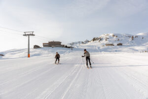 Winter ski engagement on Alpe di Siusi of vegan couple