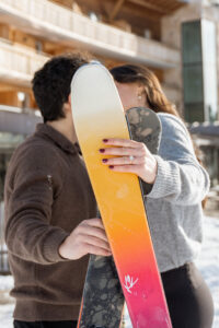 Skis and engagement ring during proposal session for vegan couple
