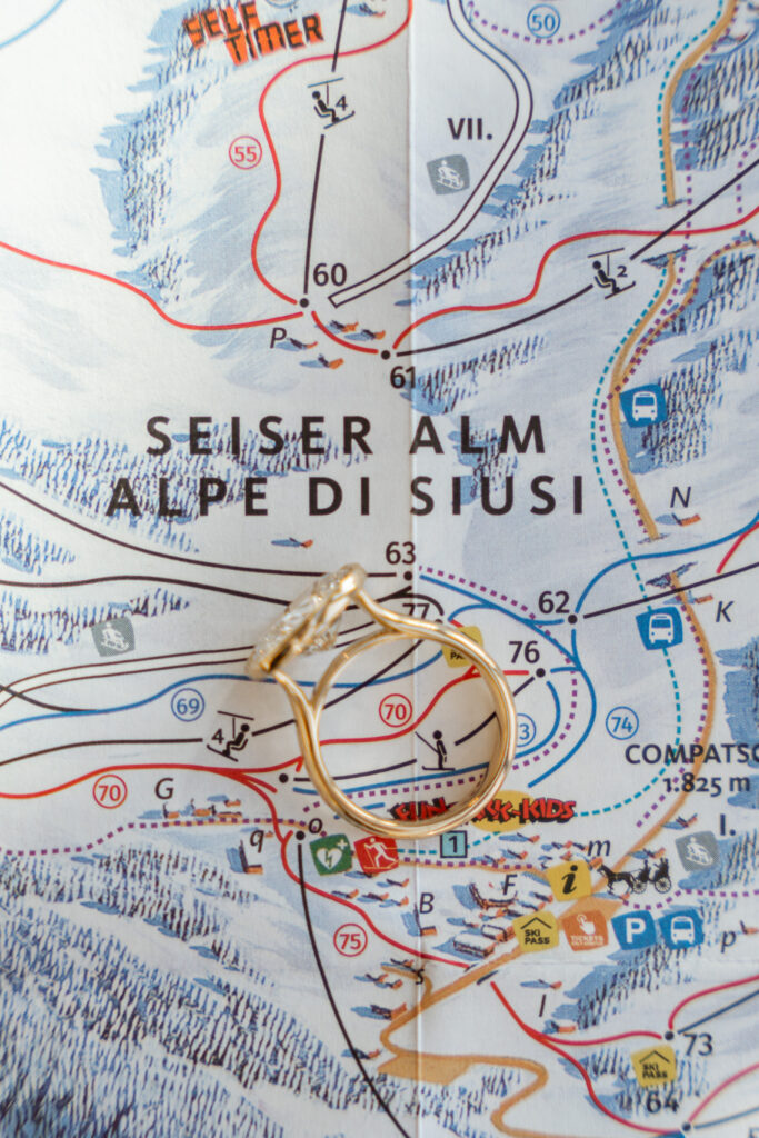 Engagement ring on ski map of Alpe di Siusi in the Dolomites