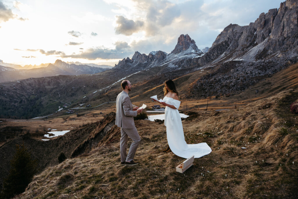 Couple eloping at sunset at Passo Giau in the Dolomites