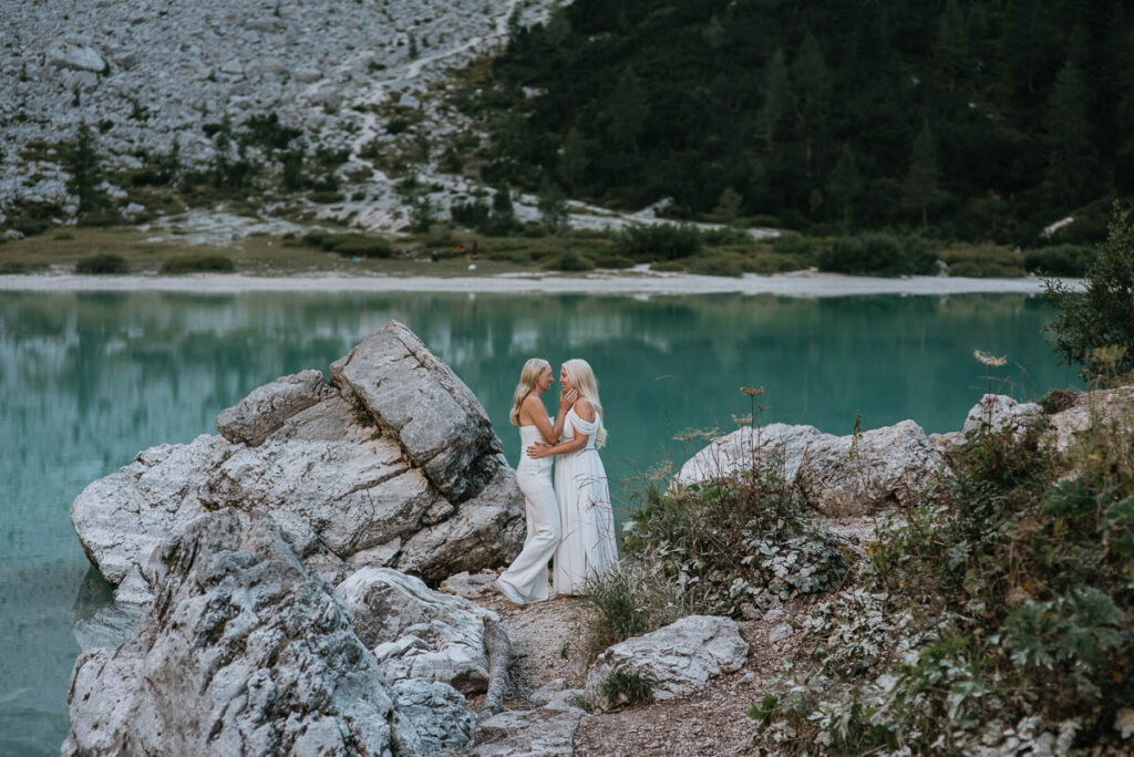 Bride and bride at Lago Sorapis in the Dolomites for their elopement. Why you should have a mutliday elopement