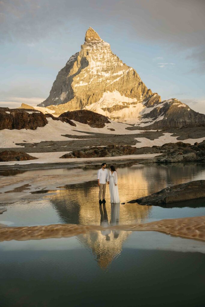 Bride and groom with reflections of the Matterhorn at sunrise, Switzerland is one of the top 10 places to elope in Europe