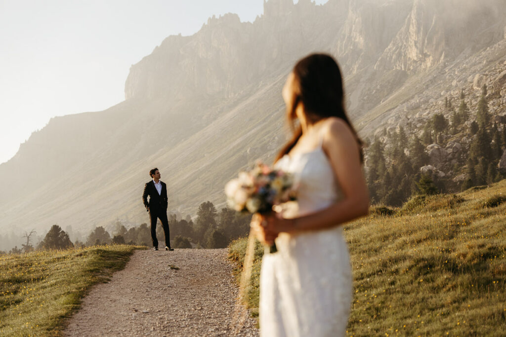 Groom looking cool in his black elopement suit in the Dolomites