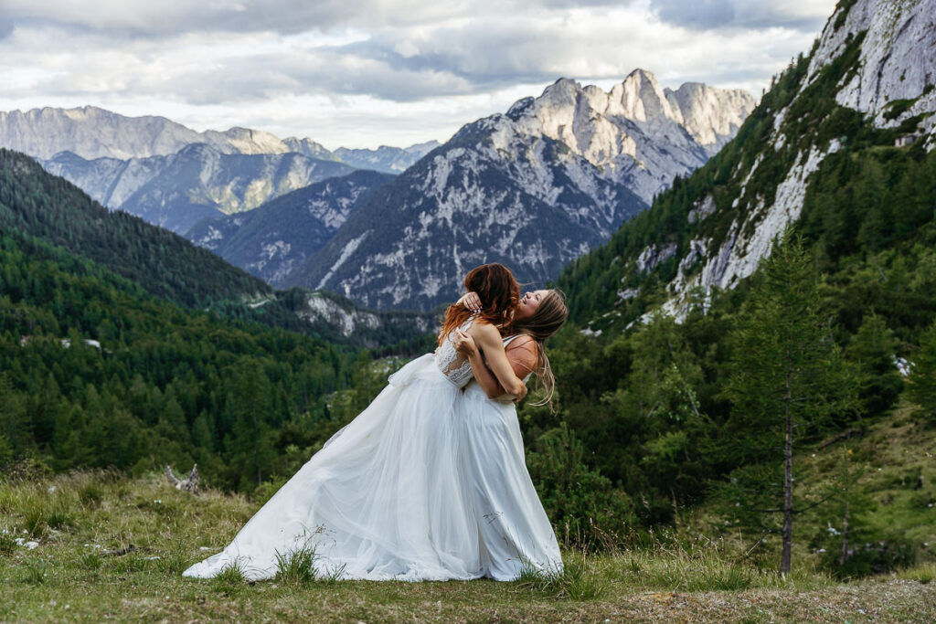Bride and bride having fun at sunset during their elopement in Slovenia, one of the top 10 places to elope in Europe