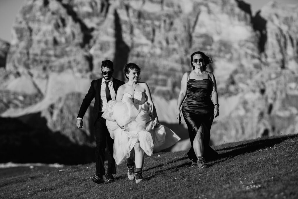 Bride and groom including bride's sister during their hiking elopement in Cadini di Misurina