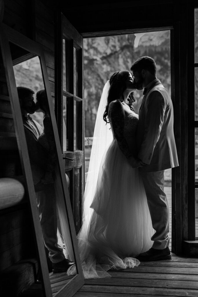 Silhouette of a bride and groom eloping at lago di braies, one of the top ten places to elope in europe in 2027