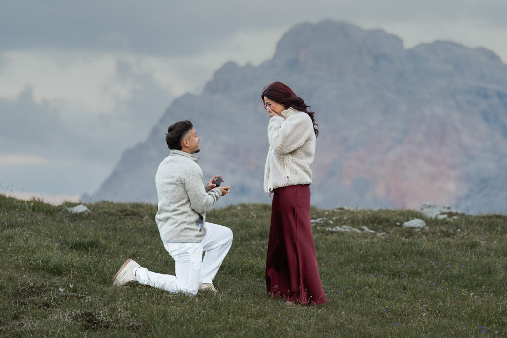 Man proposing to his wife in the Dolomites, one of the best places to propose