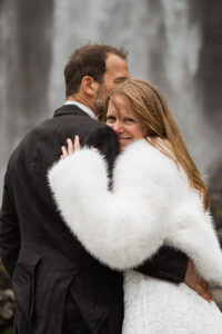 Bride and groom smiling and happy about eloping on Faroe Island at Fossà