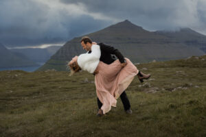 Groom dipping bride at Klakkur during their elopement