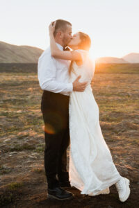 Bride and groom at sunset in Iceland avoiding heatwaves and fires for their summer elopement