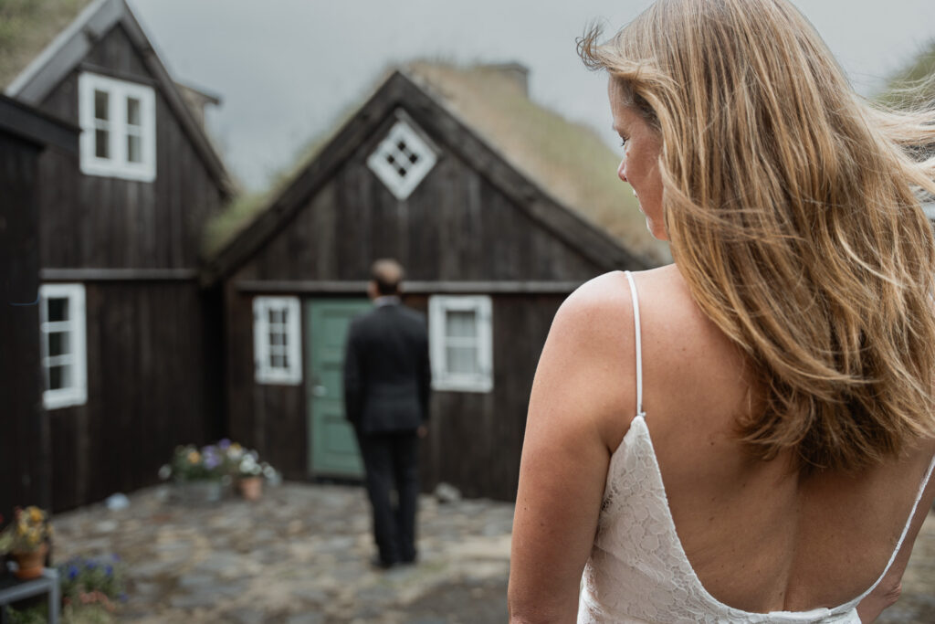 Bride about to do first look with groom in Tórshavn Faroe Islands for their elopement