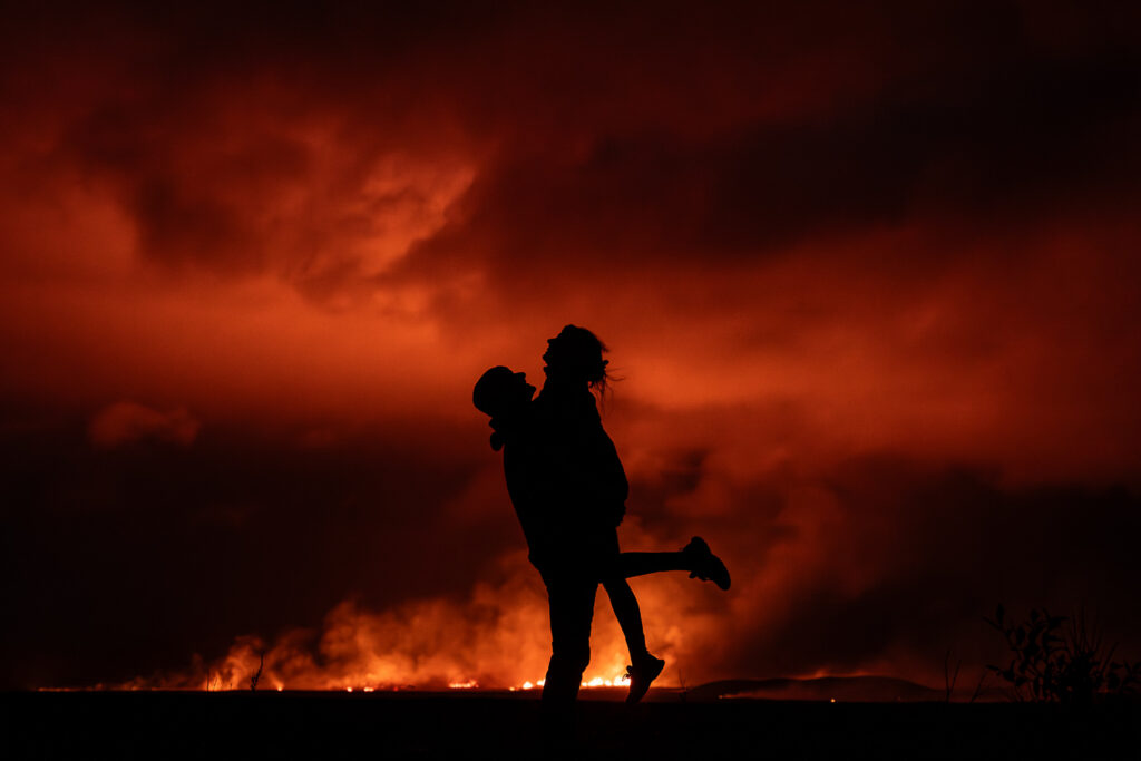 Newly eloped bride and groom in front of lava at night; things you didn't know about eloping in iceland