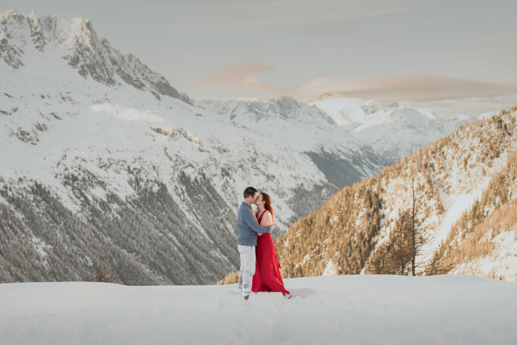 Bride and groom eloping in Chamonix with mountains in the background at sunset; Best Places to Elope on a Mountain in Europe